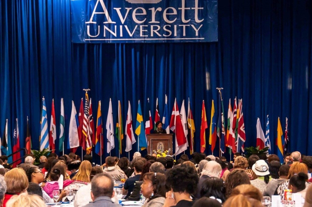 Dr. Shirley Davis speaking at a podium at Averett University